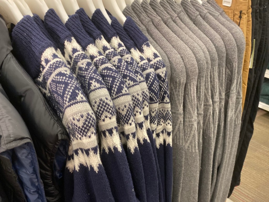 men's sweaters hanging on a target rack 