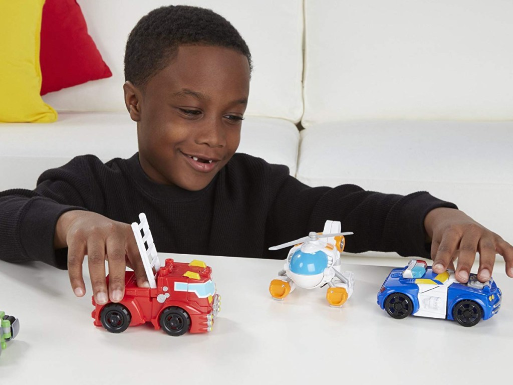 Kids playing with Playskool Transformers Rescue Bots