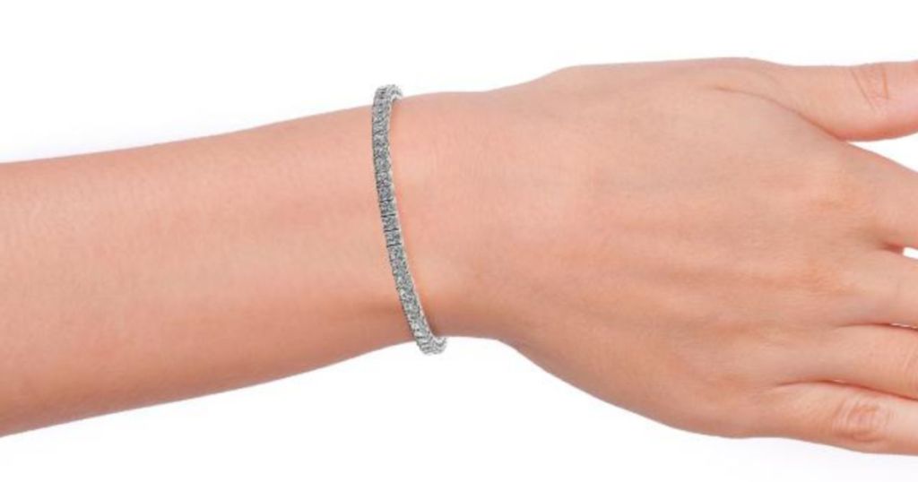 woman wrist wearing Cate & Chloe Leila 18k Gold Plated CZ Tennis Bracelet