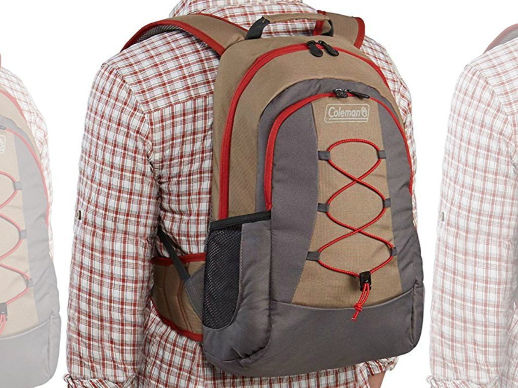 Man in flannel shirt wearing a Coleman Cooler Backpack