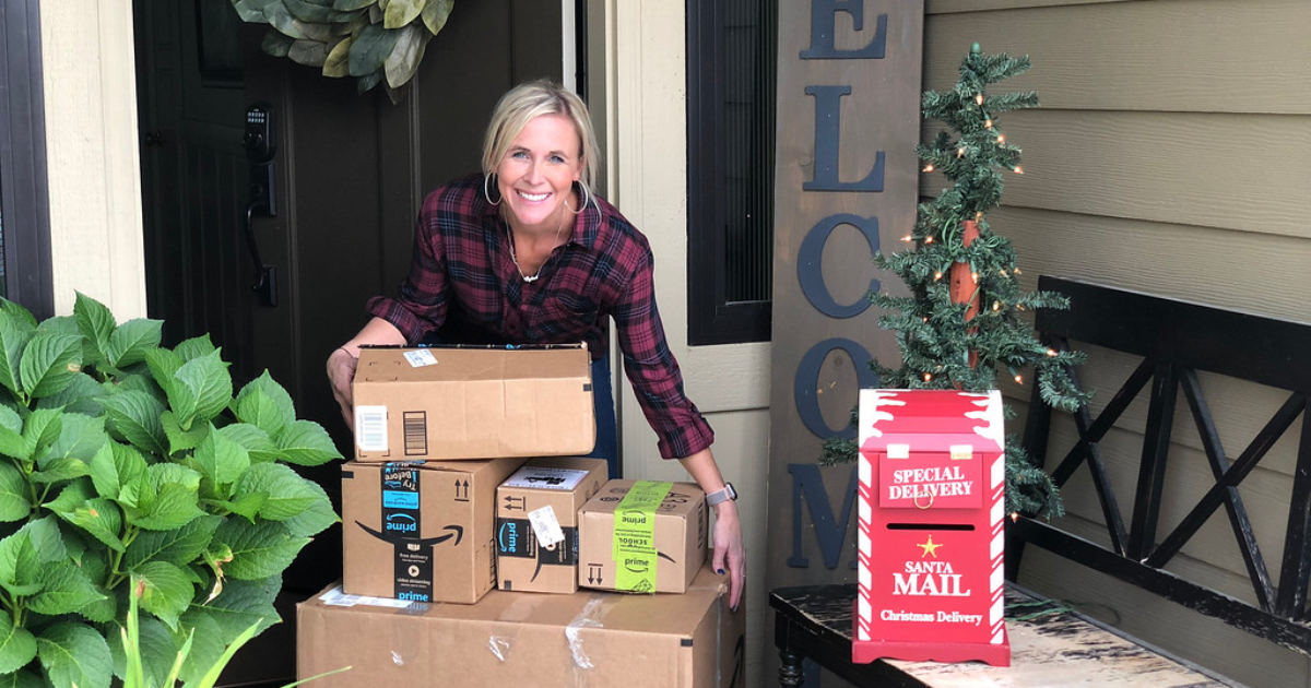 woman with Amazon boxes on porch