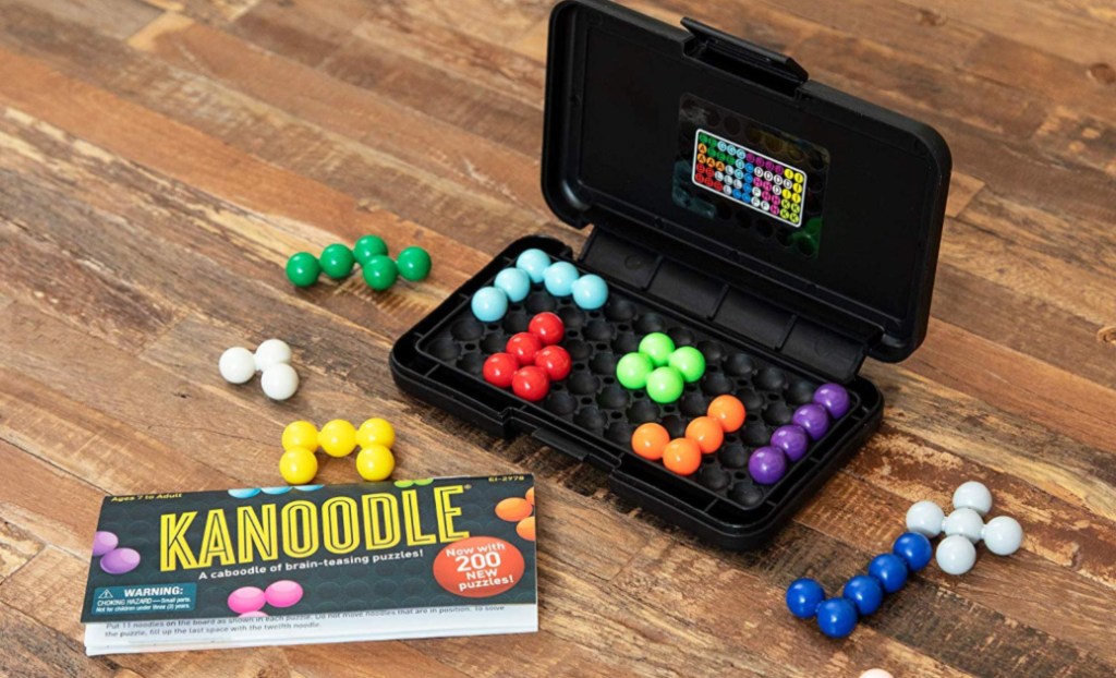 kanoodle game and pieces on wood floor