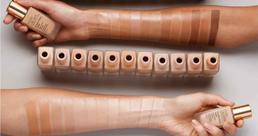 two arms with estee lauder foundation swatches