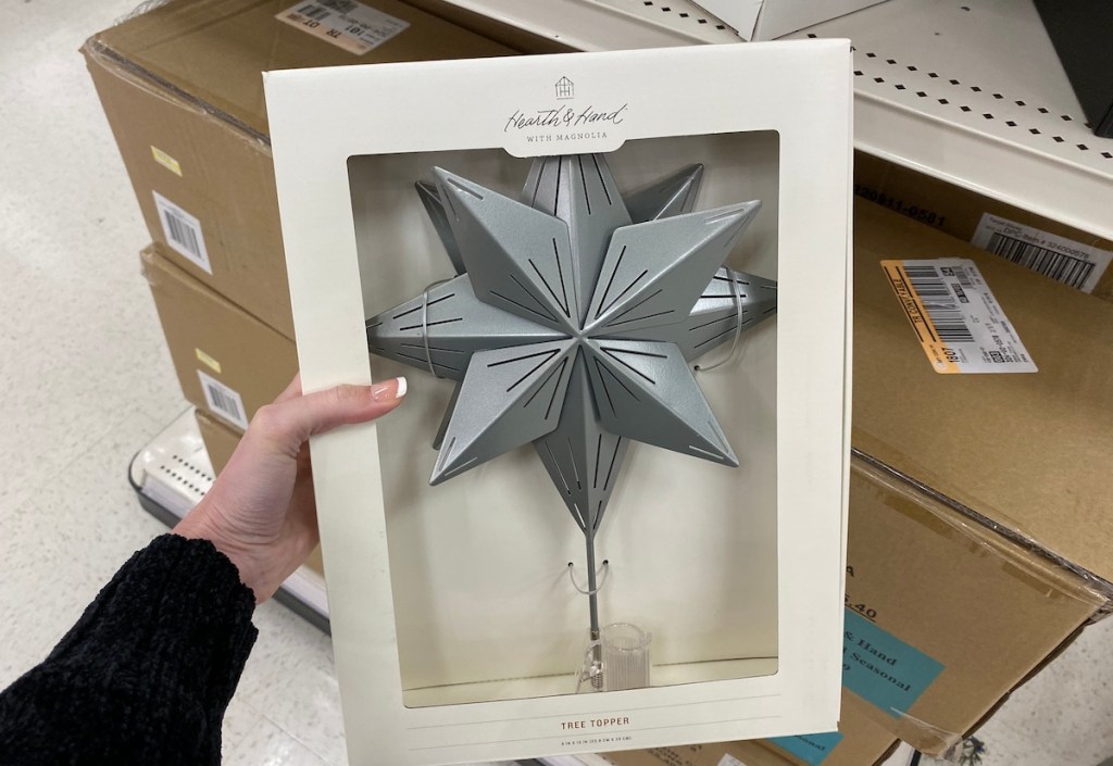 hand holding a Hearth & Hand with Magnolia Star Tree Topper