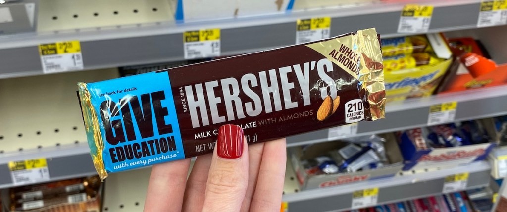 hand holding a Hershey's Bar