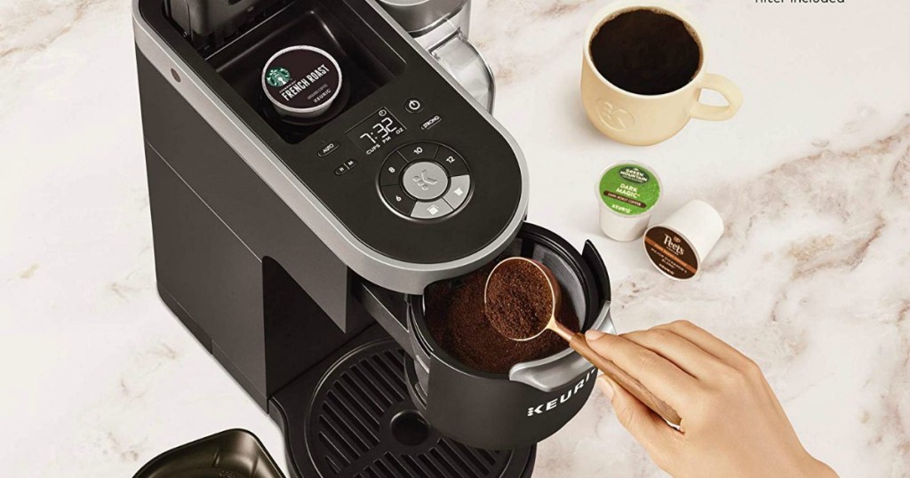 Woman loading coffee into Keurig K-Duo