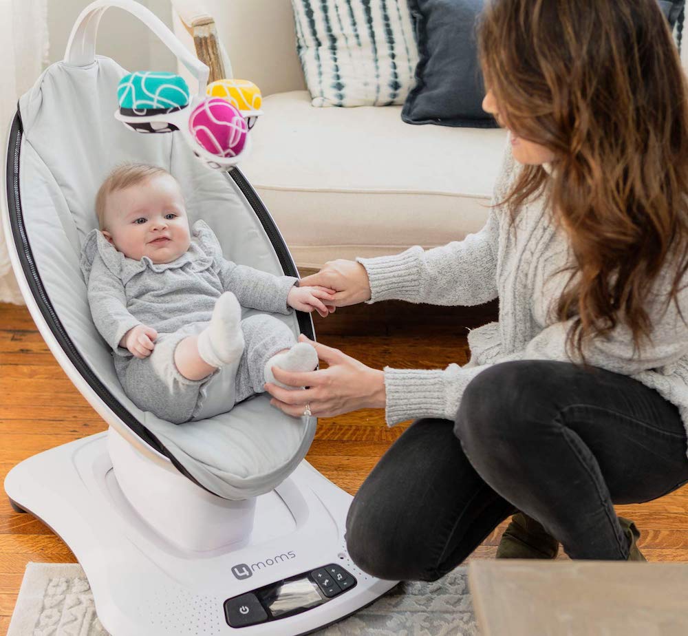 woman next to baby in Mamaroo swing