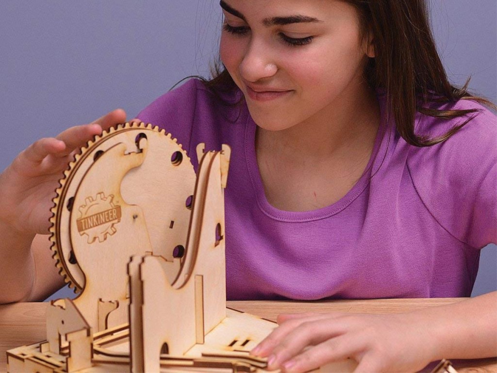 girl playing with Marbleocity Dragon Coaster