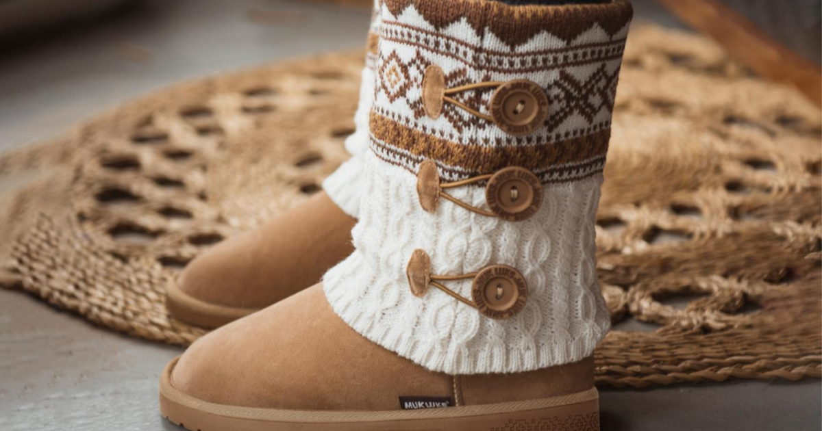 pair of muk luks boots next to a rug