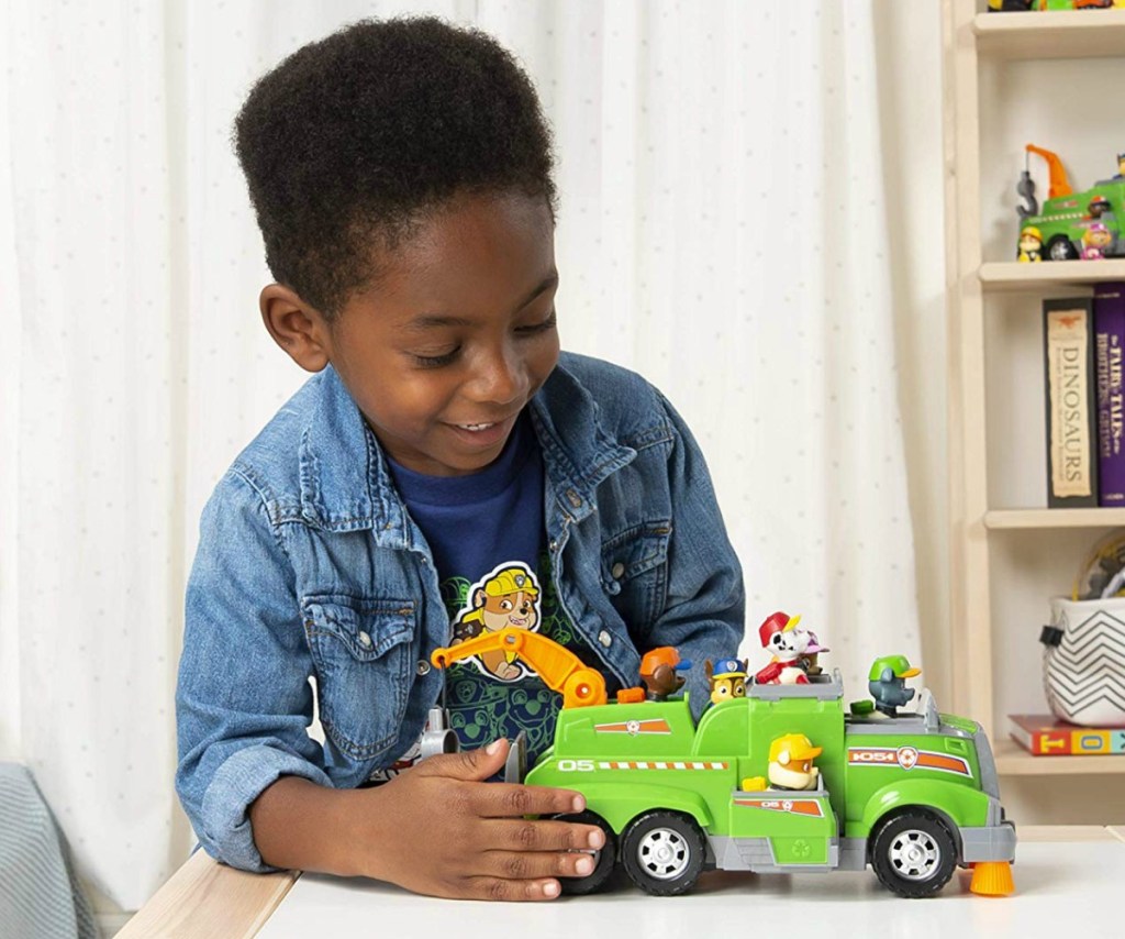 boyplaying with Paw Patrol Rescue Recycling Truck