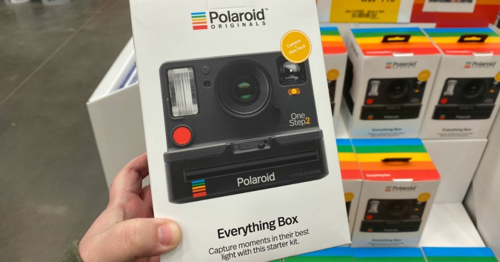 woman holding a Polaroid Everything Box