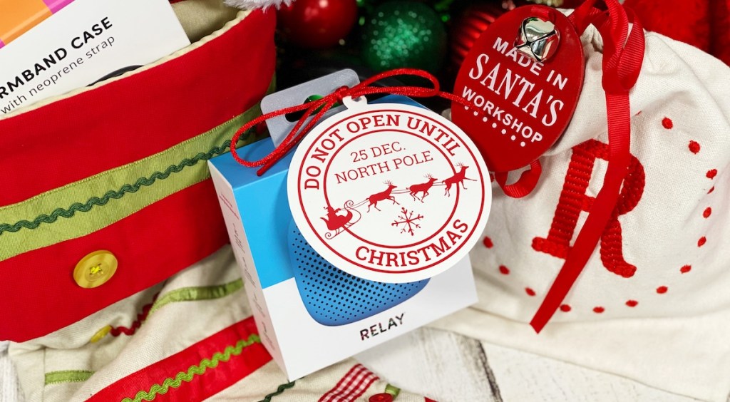 Relay Tracker next to stocking with gift tag