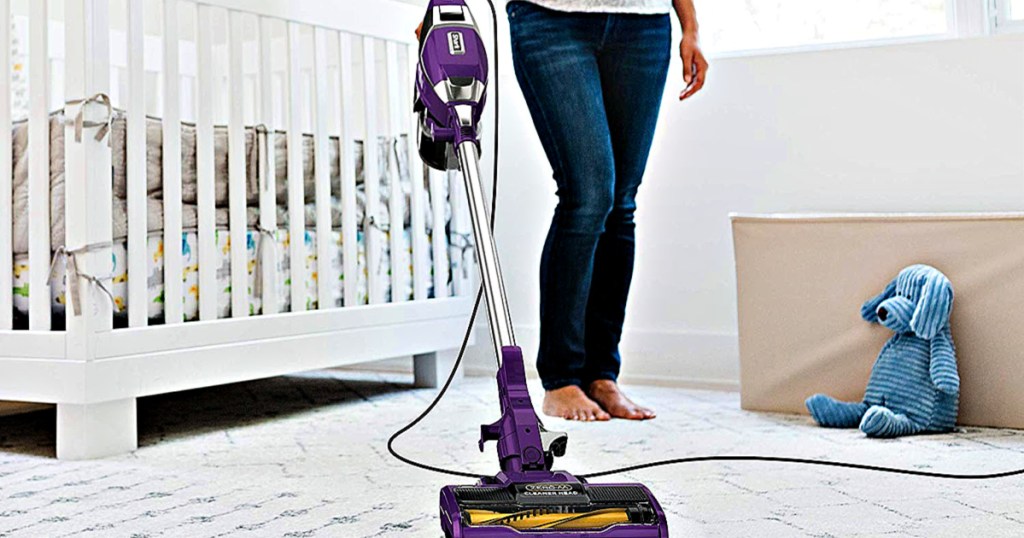 Shark Rocket Corded Ultra-Light Vacuum with Zero-M Anti-Hair Wrap Technology being used by woman in nursery