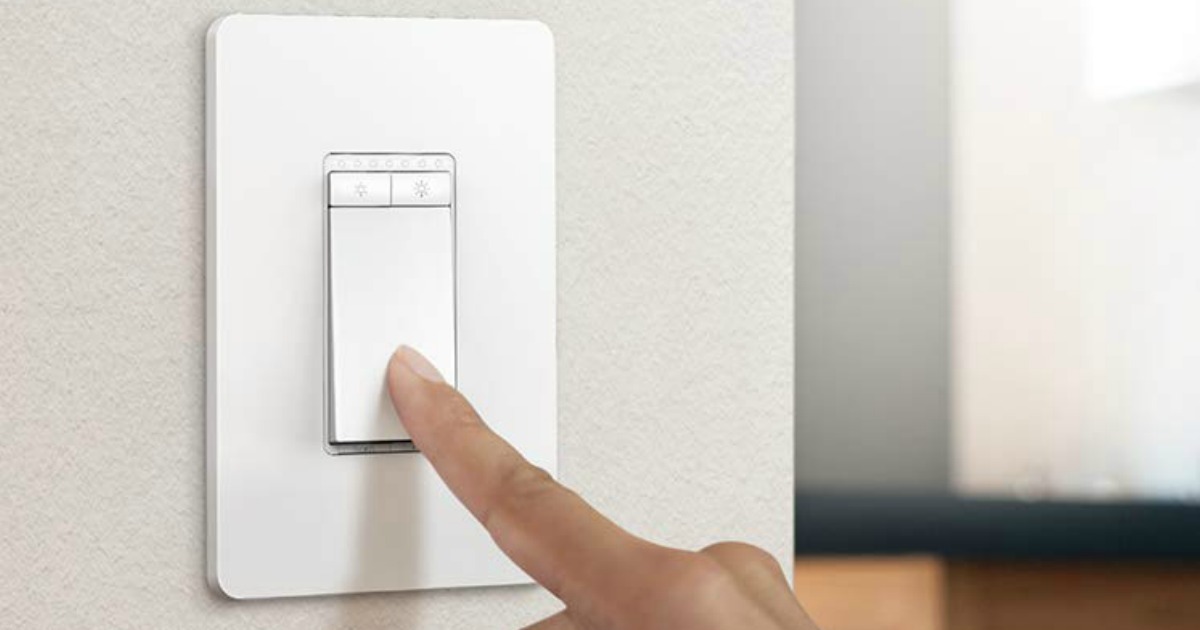 Woman using a smart WiFi light switch