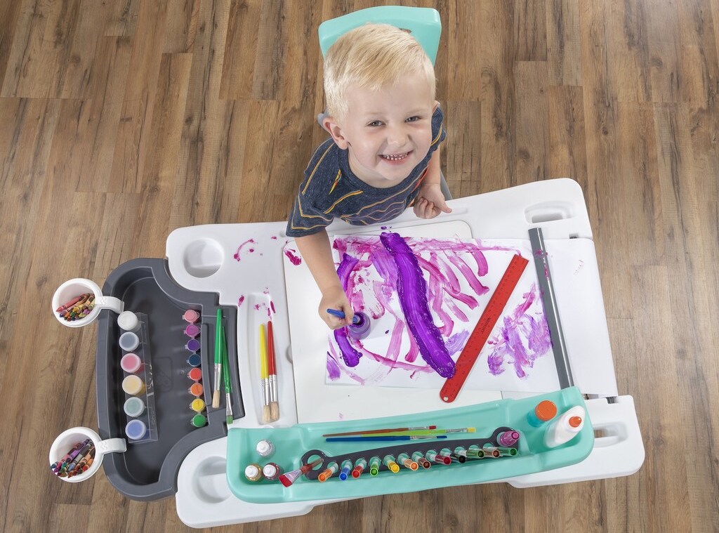 kid painting on the Step2 Arts Desk