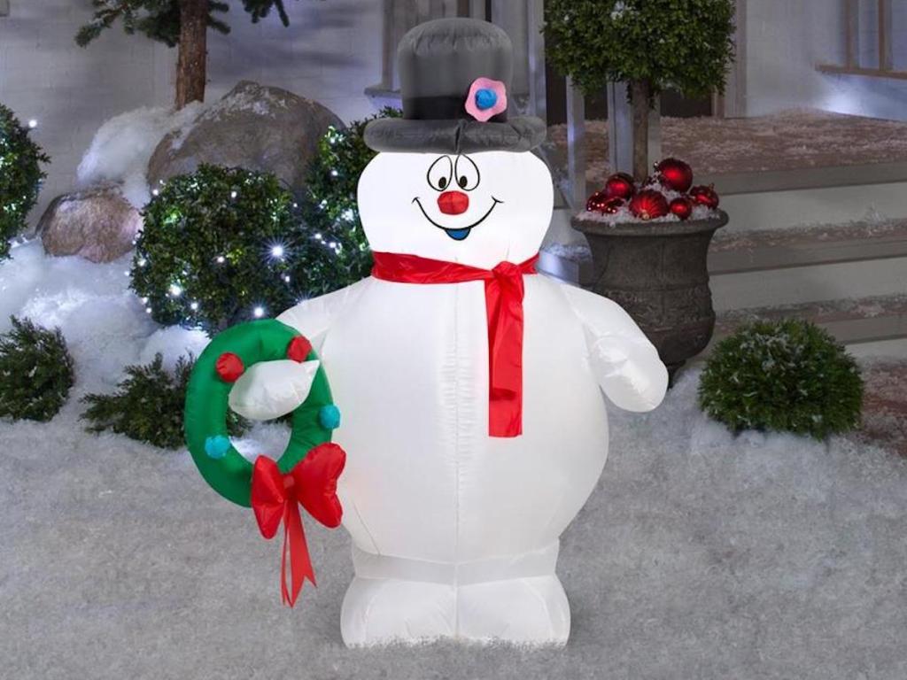 Warner Brothers Lighted Frosty Christmas Inflatable in front yard