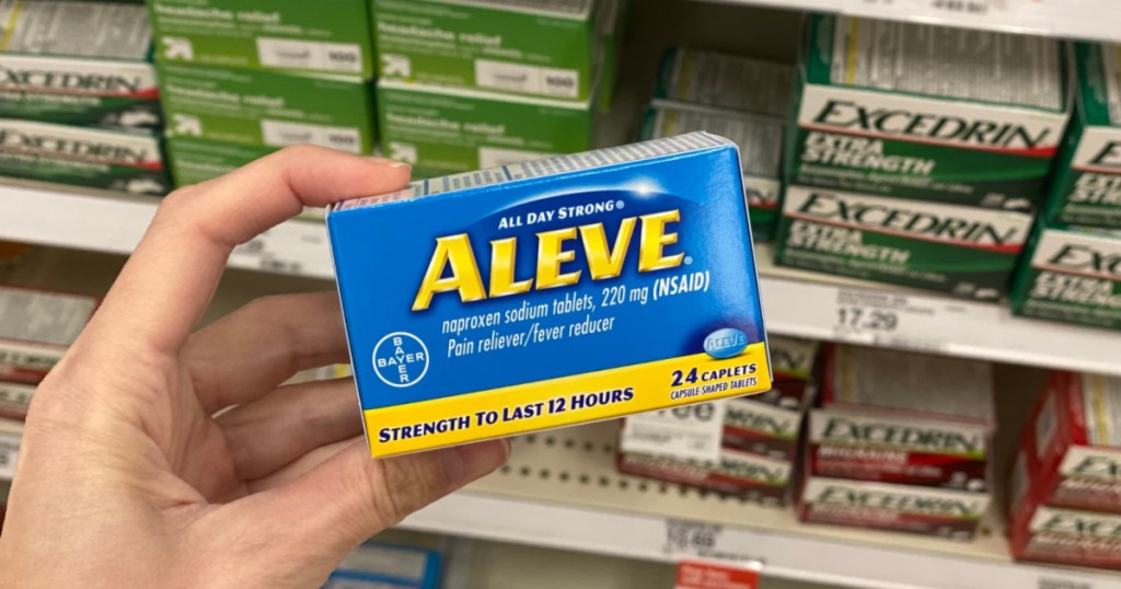 hand holding up box of aleve pain reliever