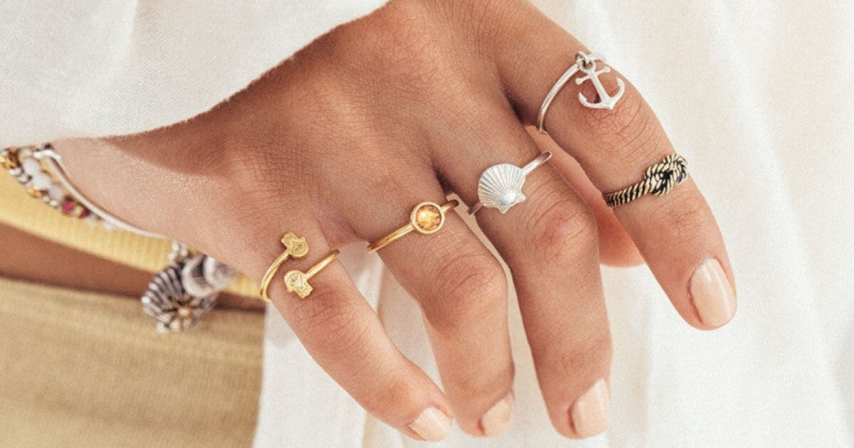 hand with rings on every finger