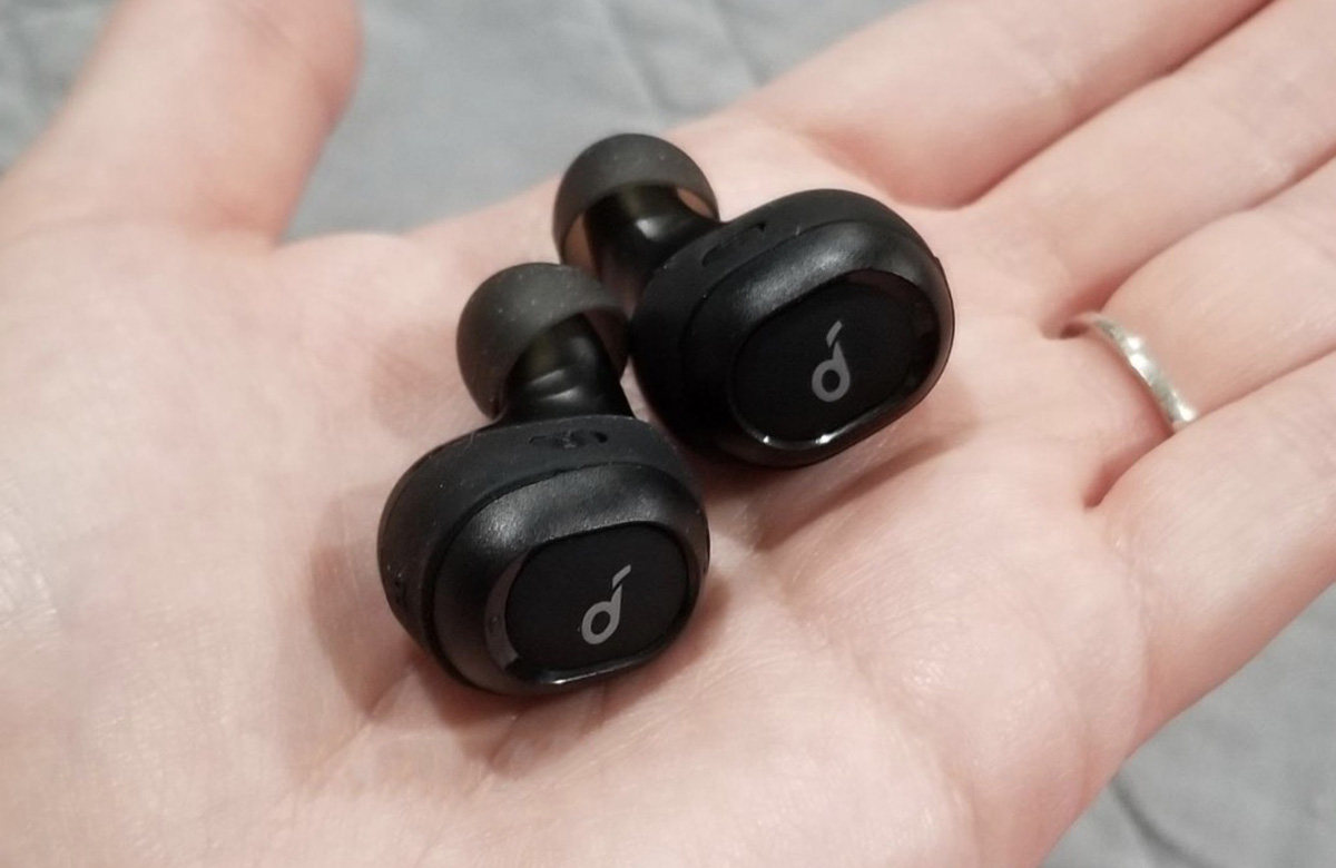 anker ear buds in hand