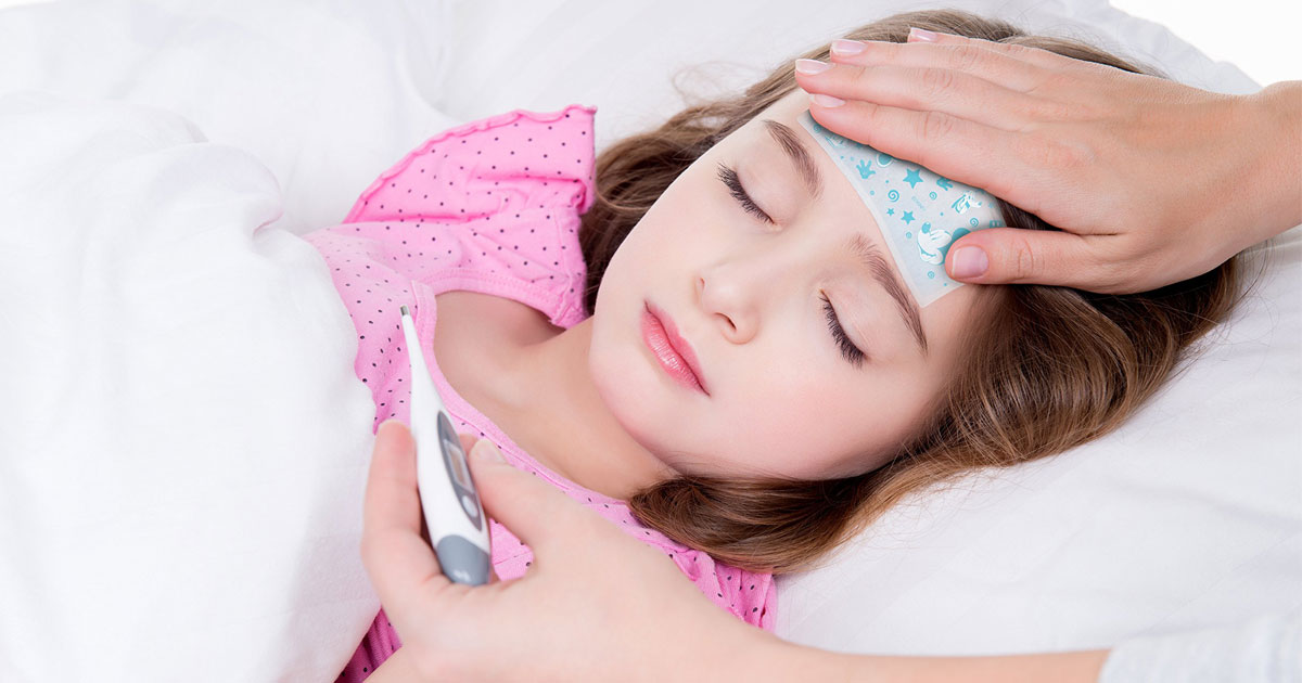 little girl with a be koool kids soft gel sheet on and mom taking temperature