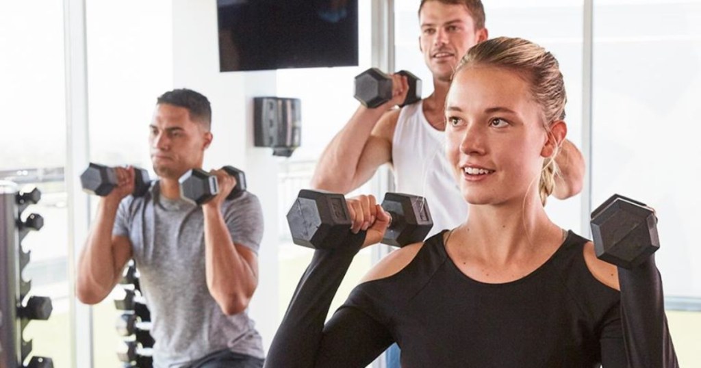 three people working out with free weights