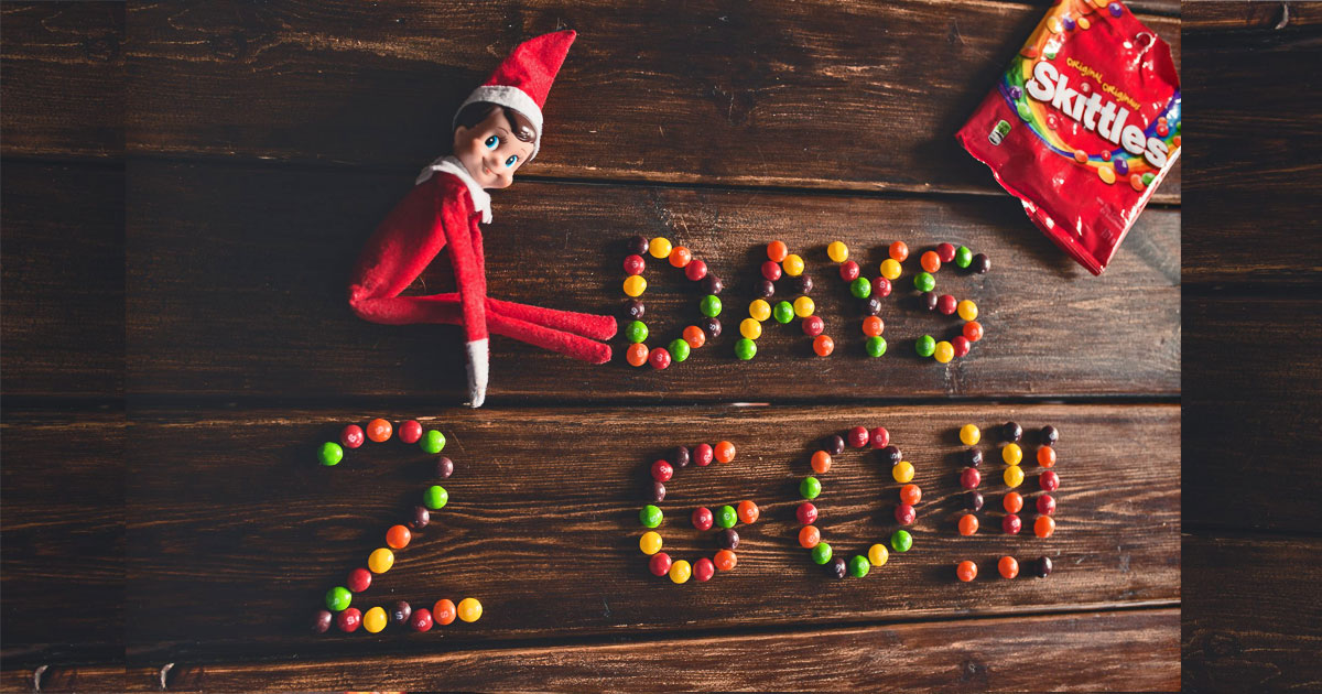 Elf on the Shelf with message spelled using Skittles candy