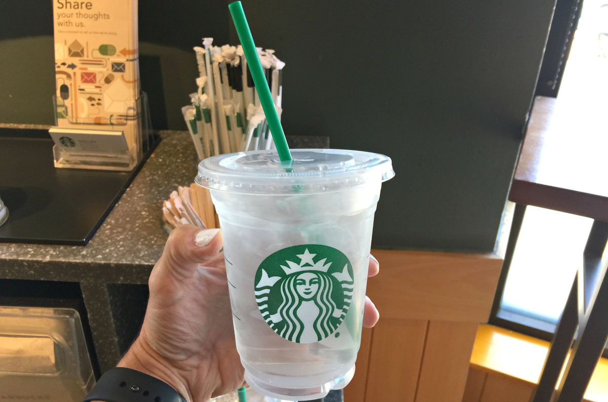 hand holding Starbucks water