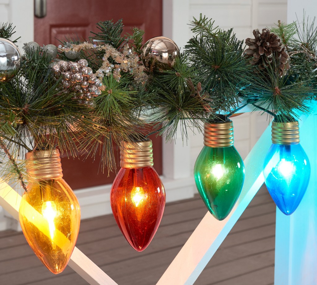 Holiday Time Jumbo Lights on porch railing