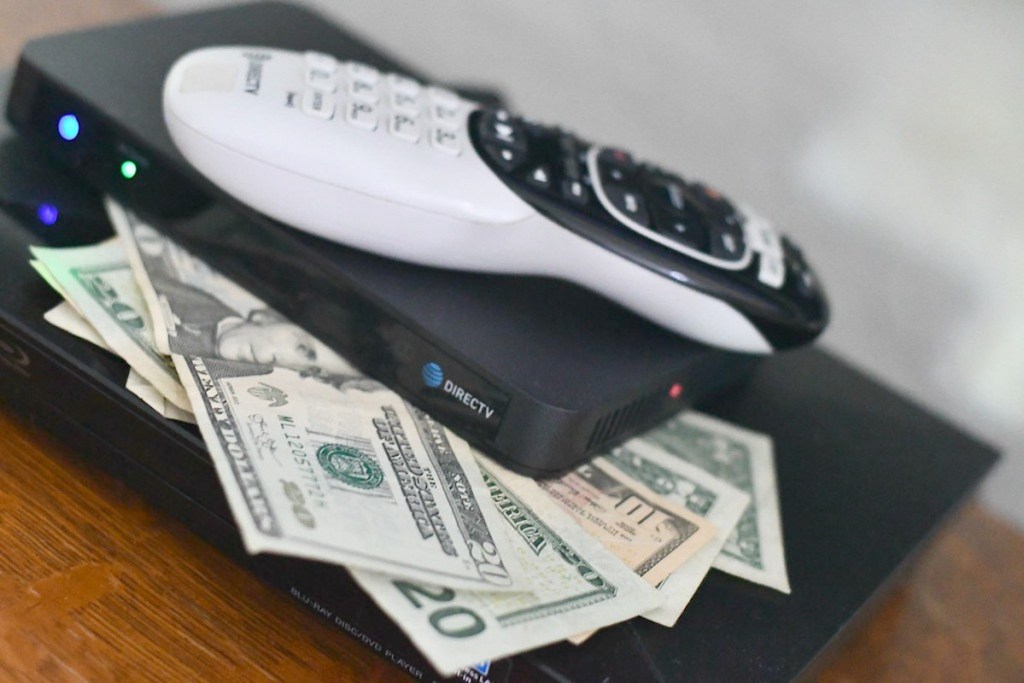 direct tv remote on top of cash money best way to save money saving
