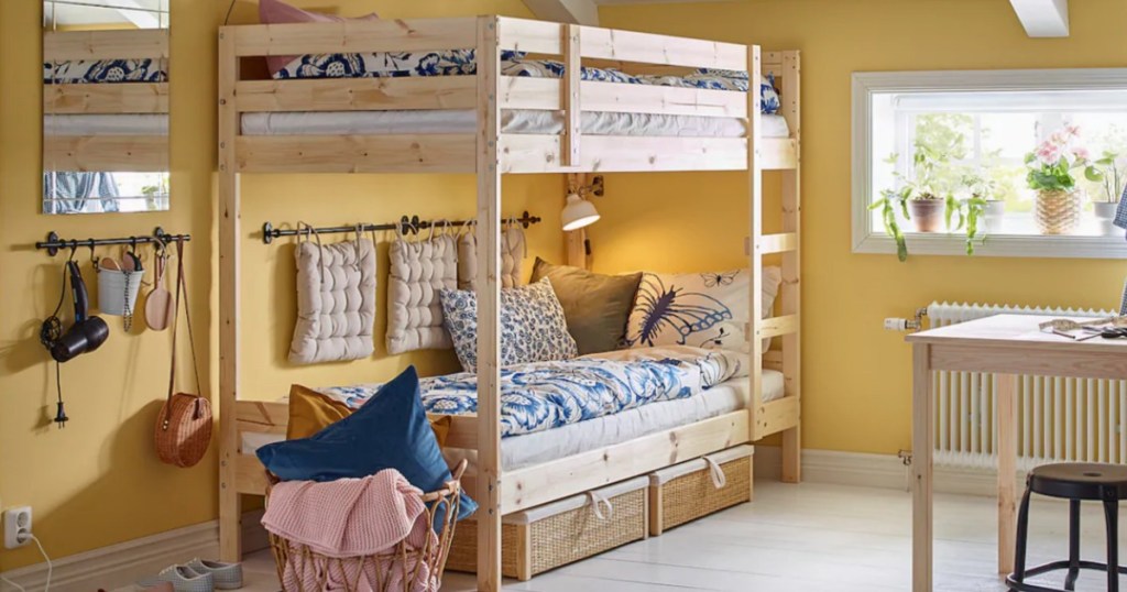 IKEA wood bunk bed in yellow painted kids bedroom