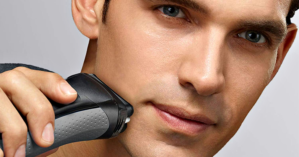 man shaving with braun electric shaver