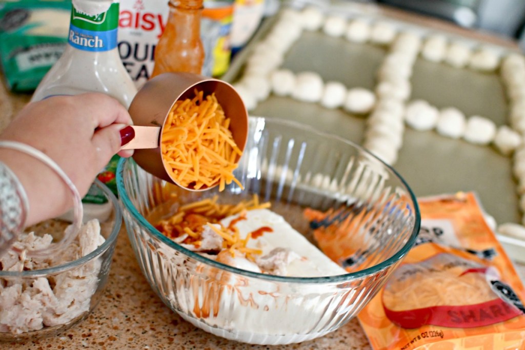 mixing up buffalo chicken dip