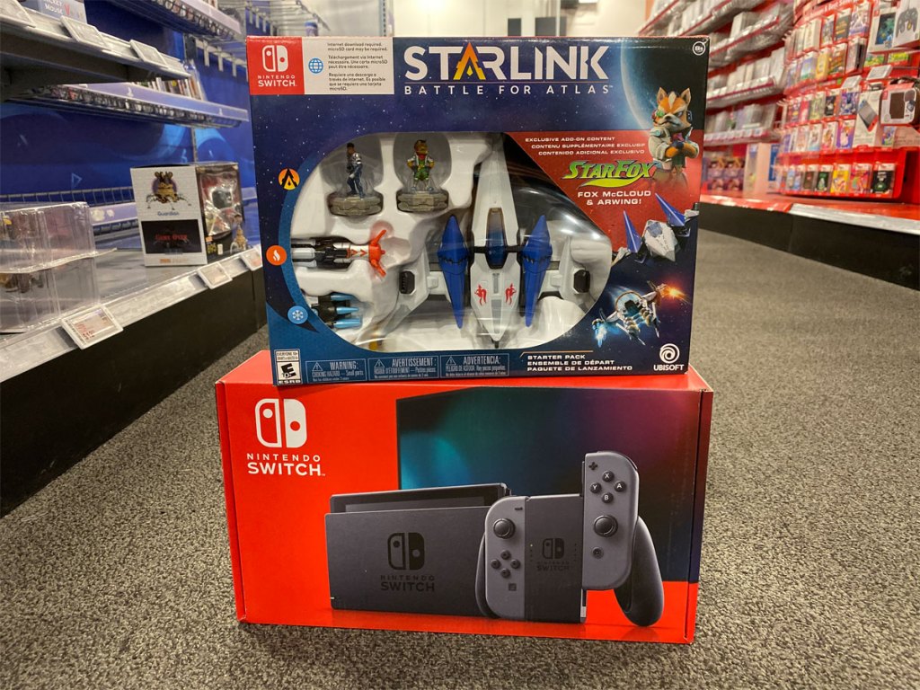 Nintendo Switch Console with Starlink Battle for Atlas Starter Kit on display in store