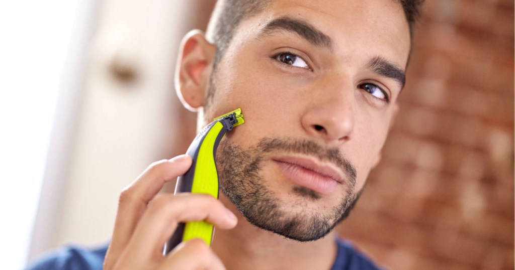 man shaving with philips norelco razor
