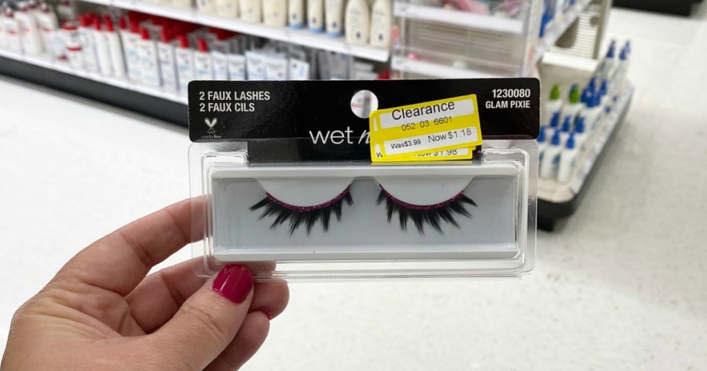 hand holding false eyelashes in a store