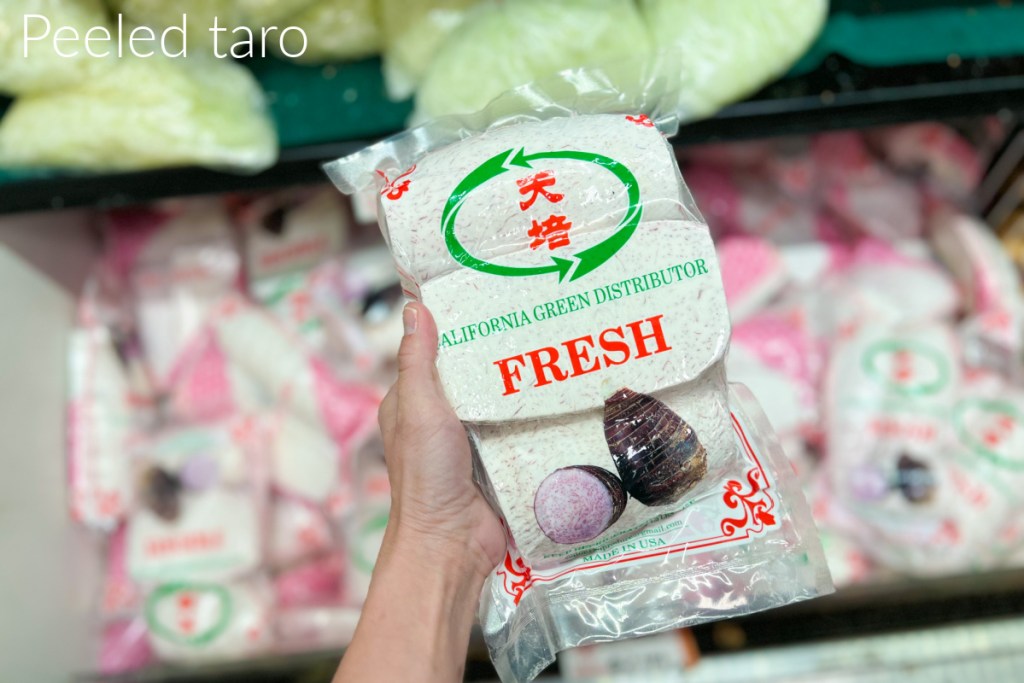 hand holding peeled taro in package