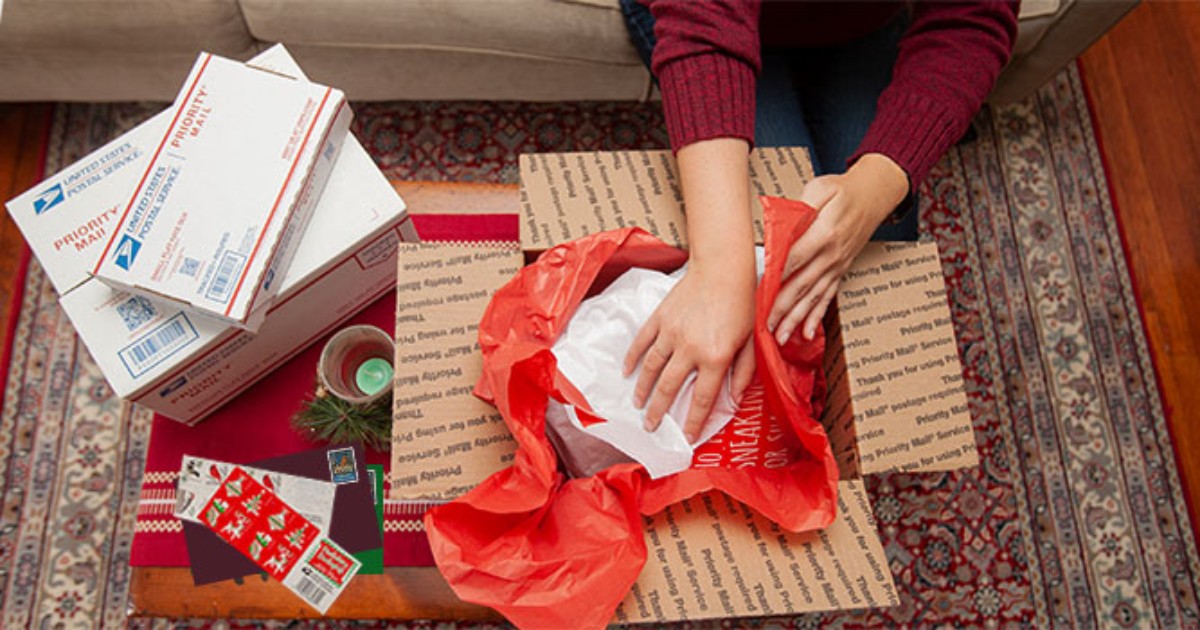 boxing up gifts in a USPS shipping box