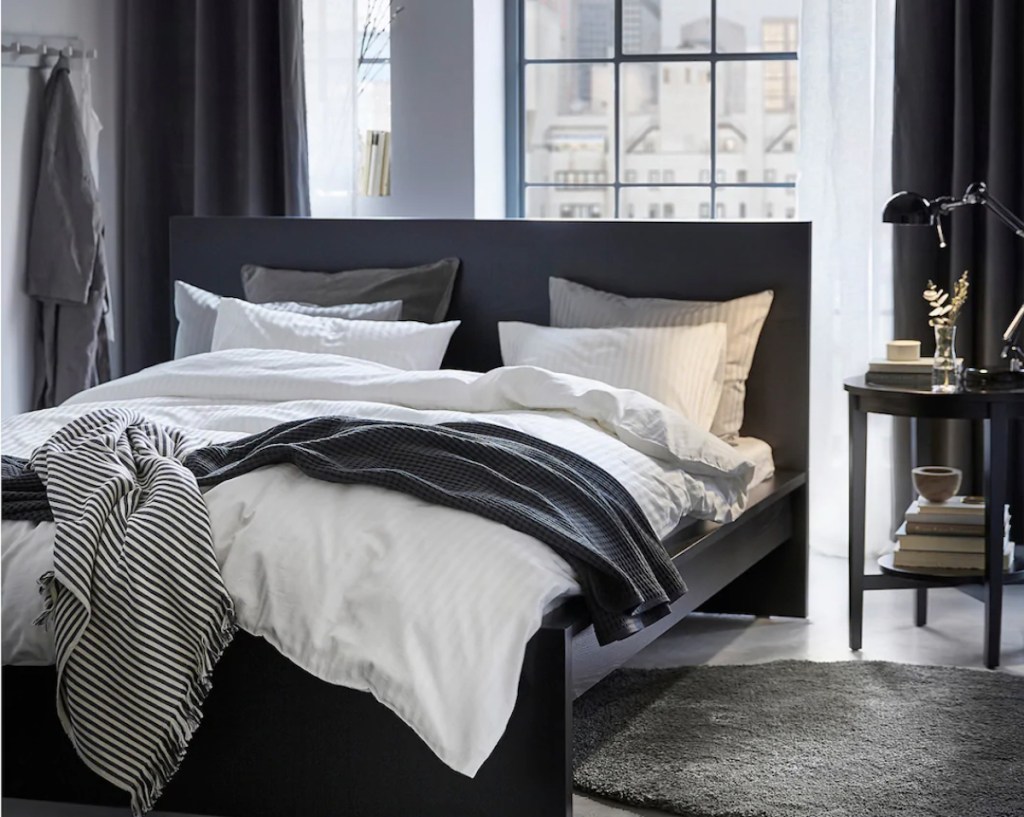 modern loft bedroom with black and white bedding