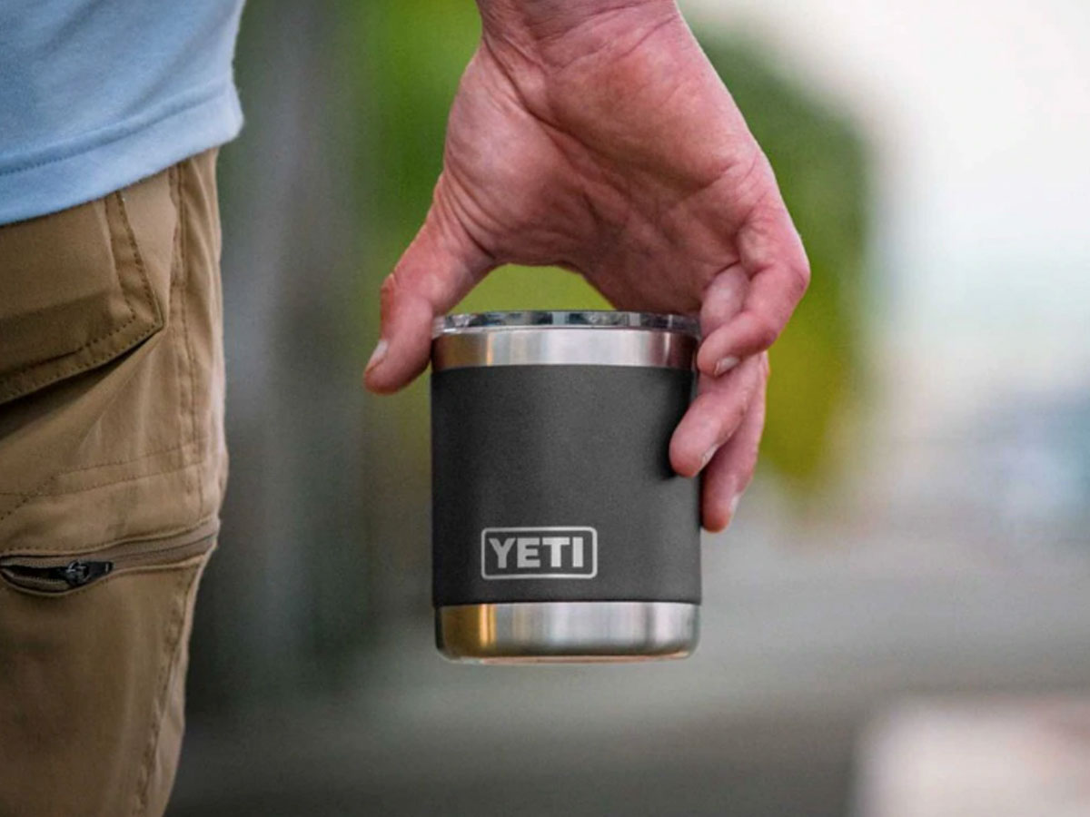 man holding a YETI 10oz Rambler Lowball Cup 