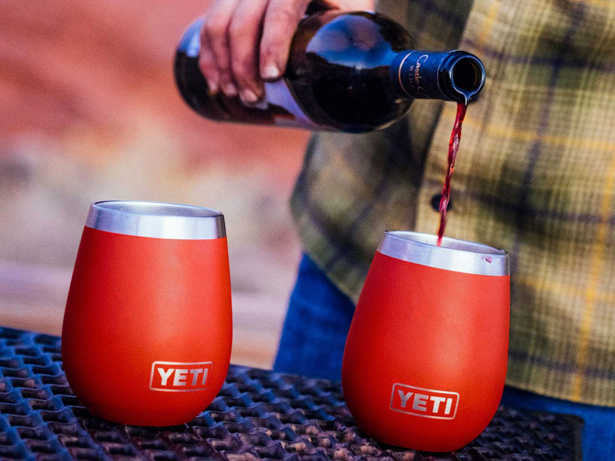 hand pouring wine in to YETI 10oz Rambler Wine Tumbler