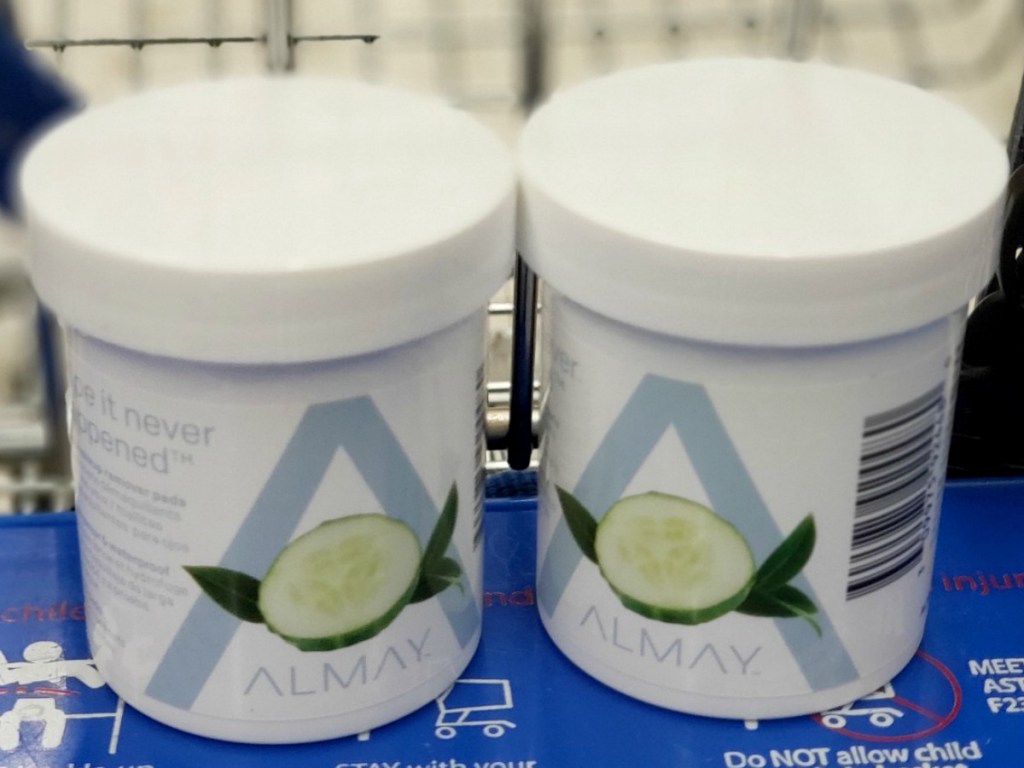 Two containers of Almay brand eye makeup remover pads in cart at Walgreens