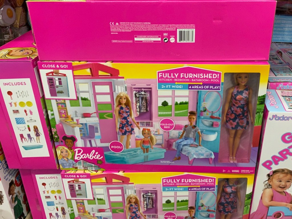 Barbie Playhouses stacked in boxes at warehouse store