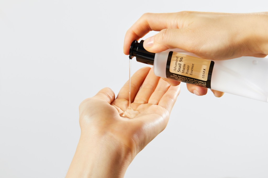 COSRX Advanced Snail 96 Mucin Power Essence being poured into hand