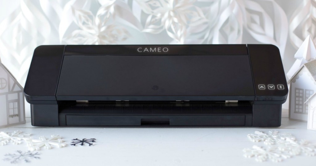 Crafting machine in black near winter decor