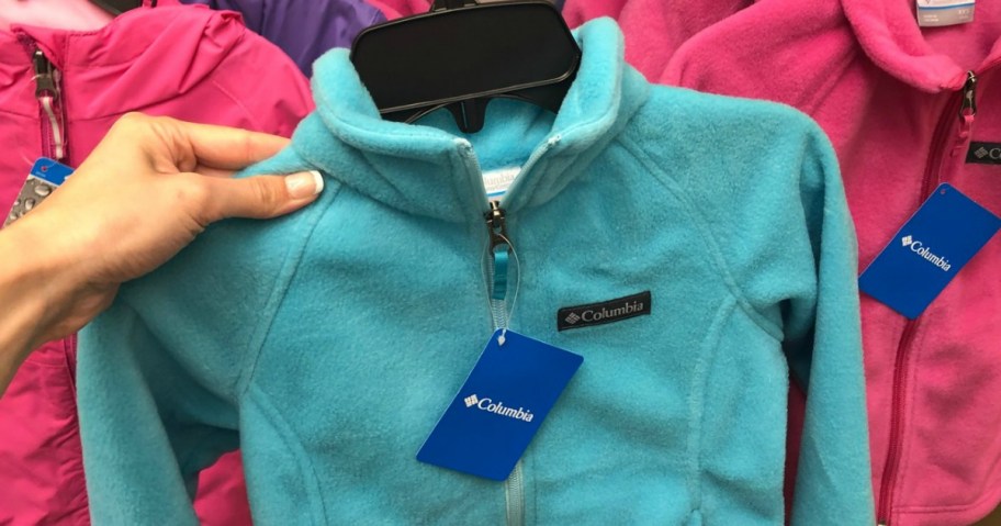 Sky blue fleece jacket on hanger in-store