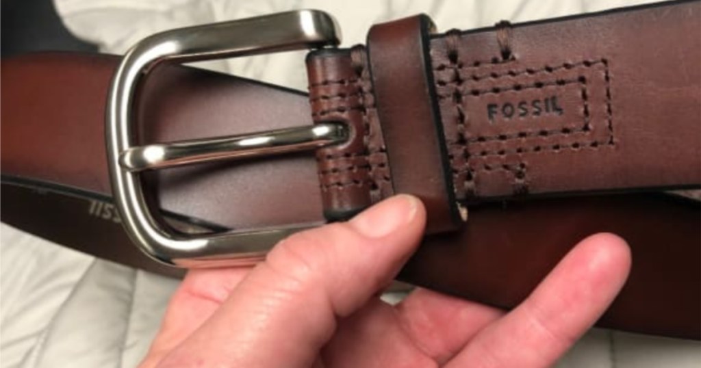 mans hand holding Fossil Men's Hanover Brown Belt