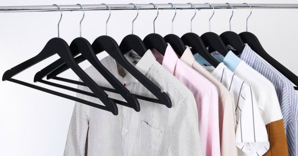 hangers on rack with clothes on hangers