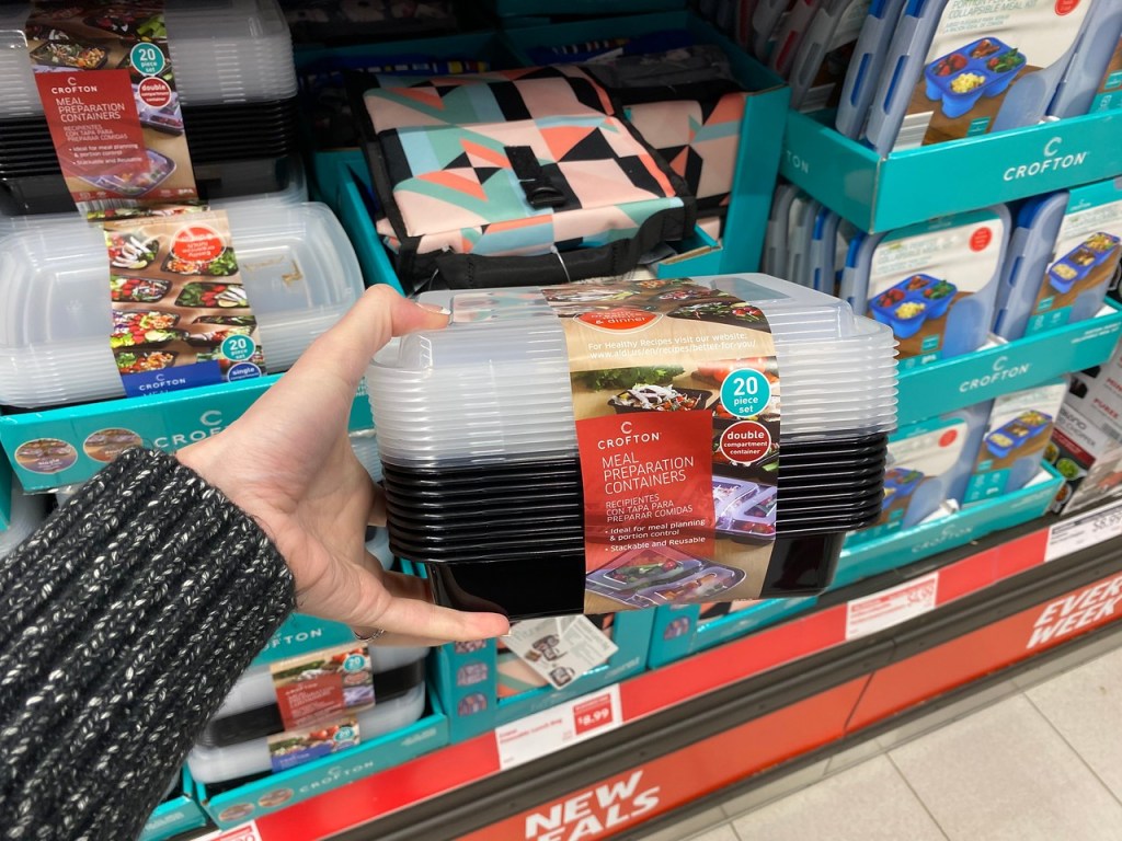 Woman's Hand Holding Meal Preparation Containers from ALDI