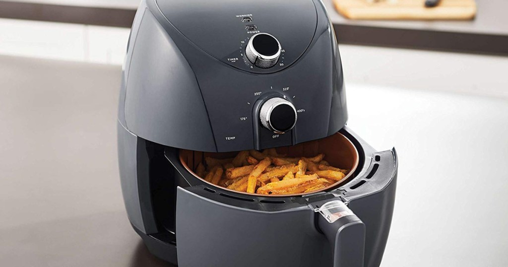 Oster Air Fryer on counter top with fries inside basket