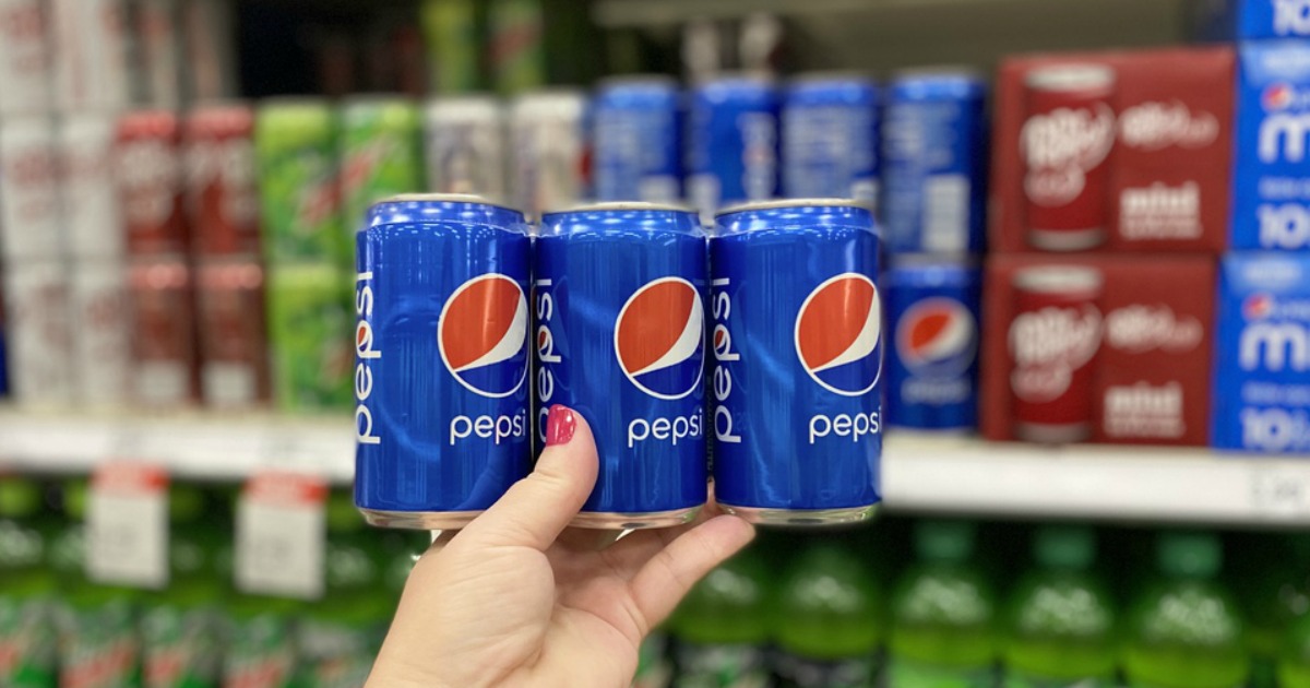 woman holding a 6-pack of Pepsi mini cans